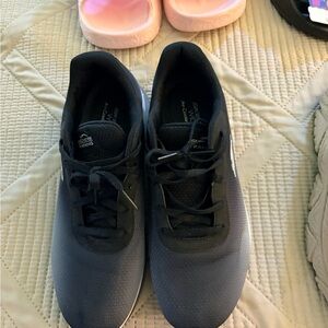 Sketchers women’s black sneakers bundled with tan women’s sneakers.